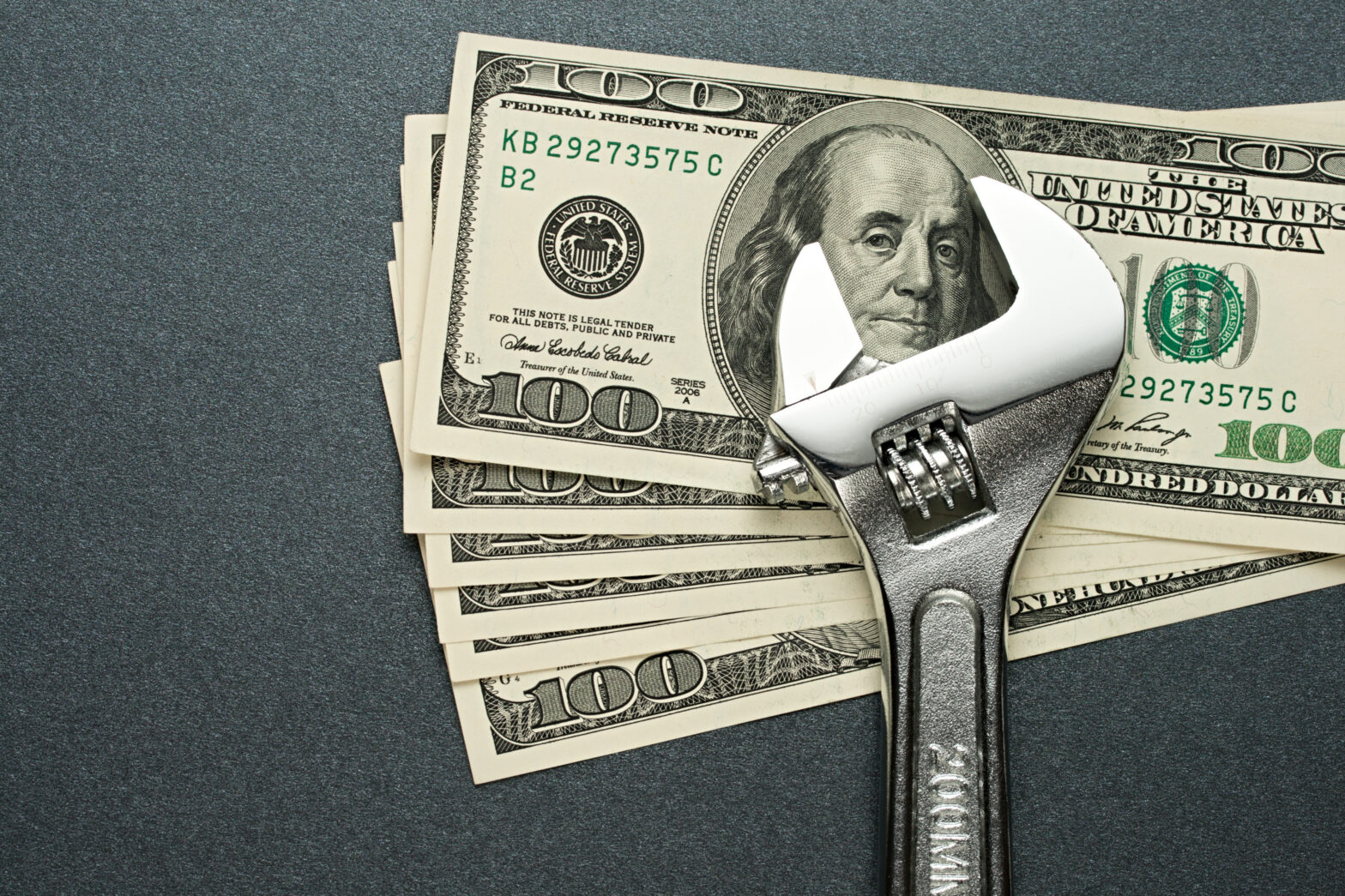 Money and Wrench AdobeStock 42254185