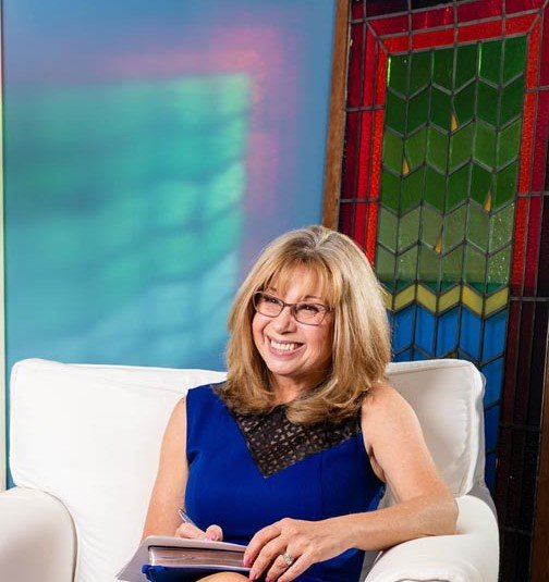 CarrieR in Chair smiling at Client 101323 096.jpg